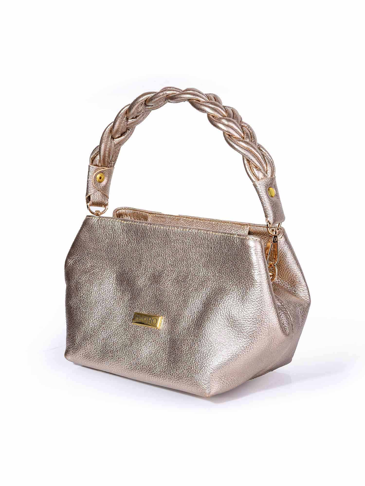 Bolso de mano hexagonal modelo Adele en color dorado de Zuoro Shoes, con asa rígida trenzada y herrajes dorados de lujo