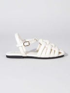 Lateral de sandalia blanca Gemma con cierre de hebilla al tobillo, calzado plano cómodo y seguro de Zuoro Shoes