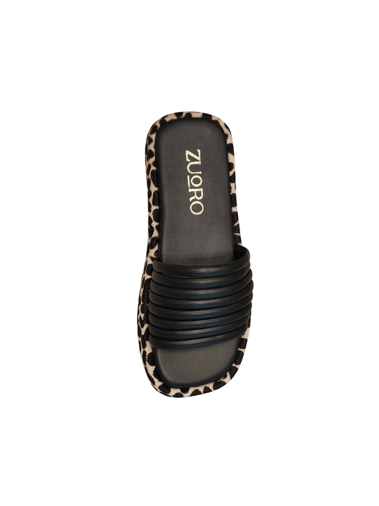 Vista superior de la sandalia Loto destacando la suavidad de las múltiples tiras tubulares negras y la amplitud de la horma