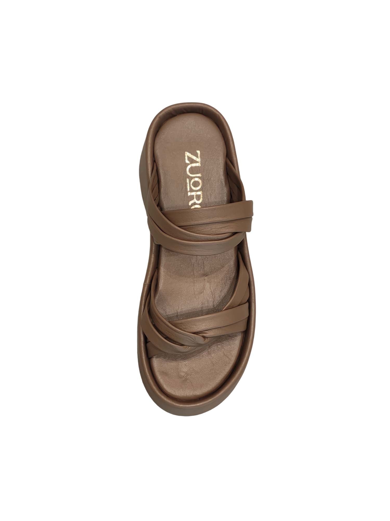 Vista superior de la sandalia Seda destacando el complejo entramado de tiras cruzadas y la suavidad visual del color taupe sobre la plantilla